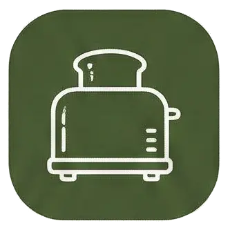 Tostadora de ranura doble en la cocina de la casa rural Can Micos (Riudarenes, Girona), ideal para desayunos de grupos grandes.